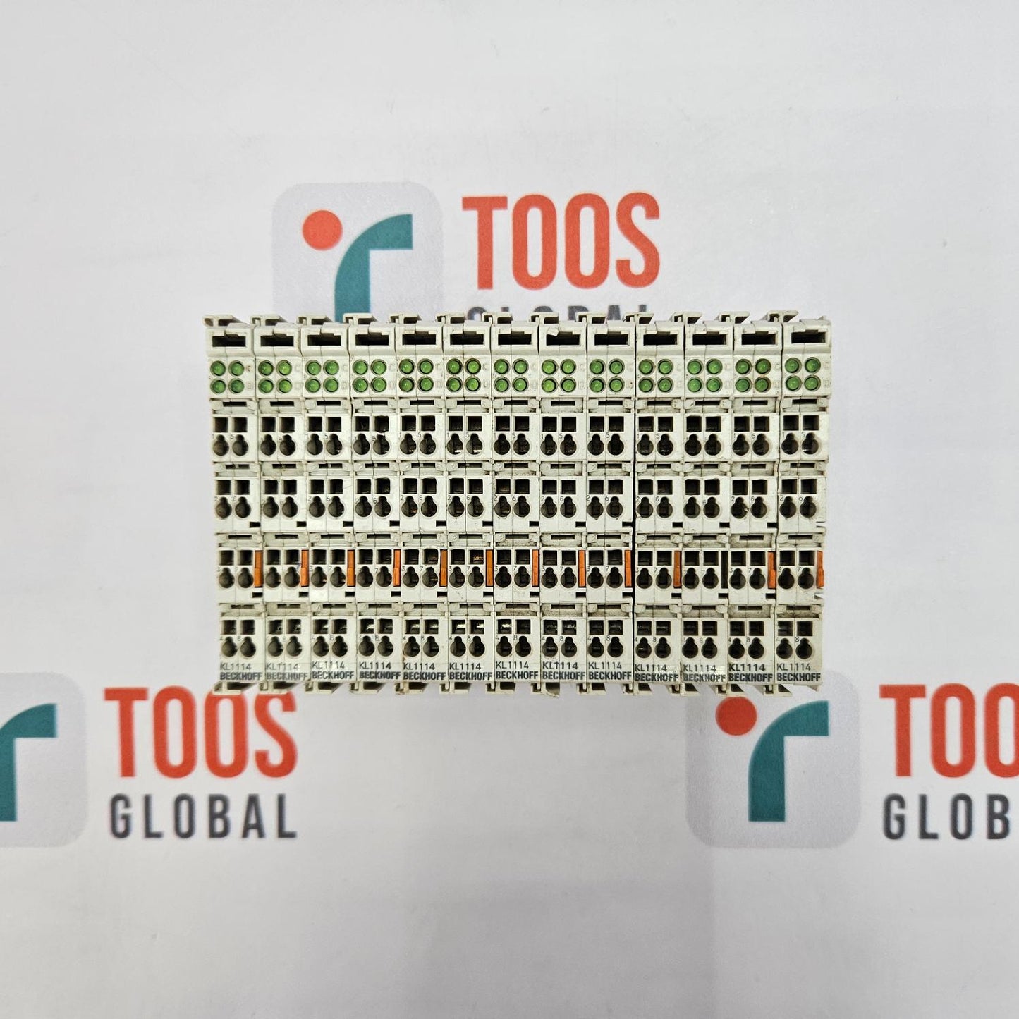 Stack of pallets with 'TOOS' and 'TOOS Global' branding on a white background