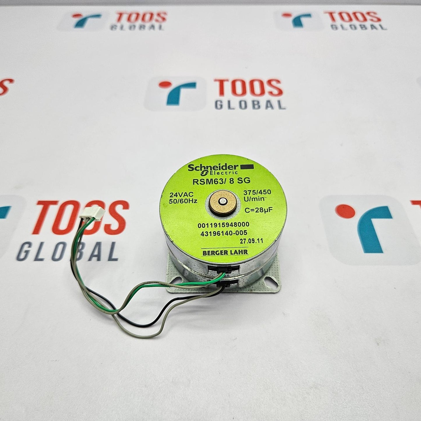 Motor with a green label on a TOOS Global branded background