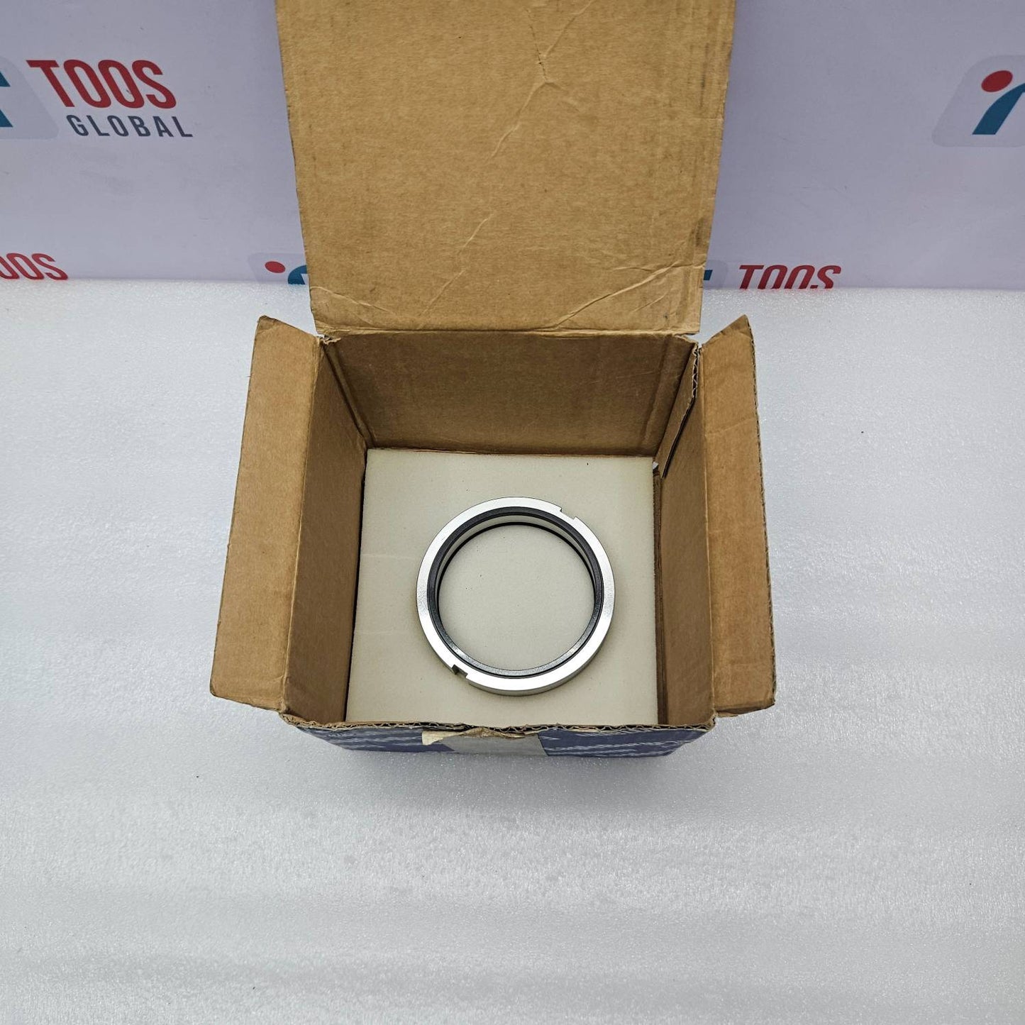 Eagle Burgmann BUKA22-12/3414 Mechanical Seal nside an open cardboard box on a white surface with 'TOOS GLOBAL' branding in the background