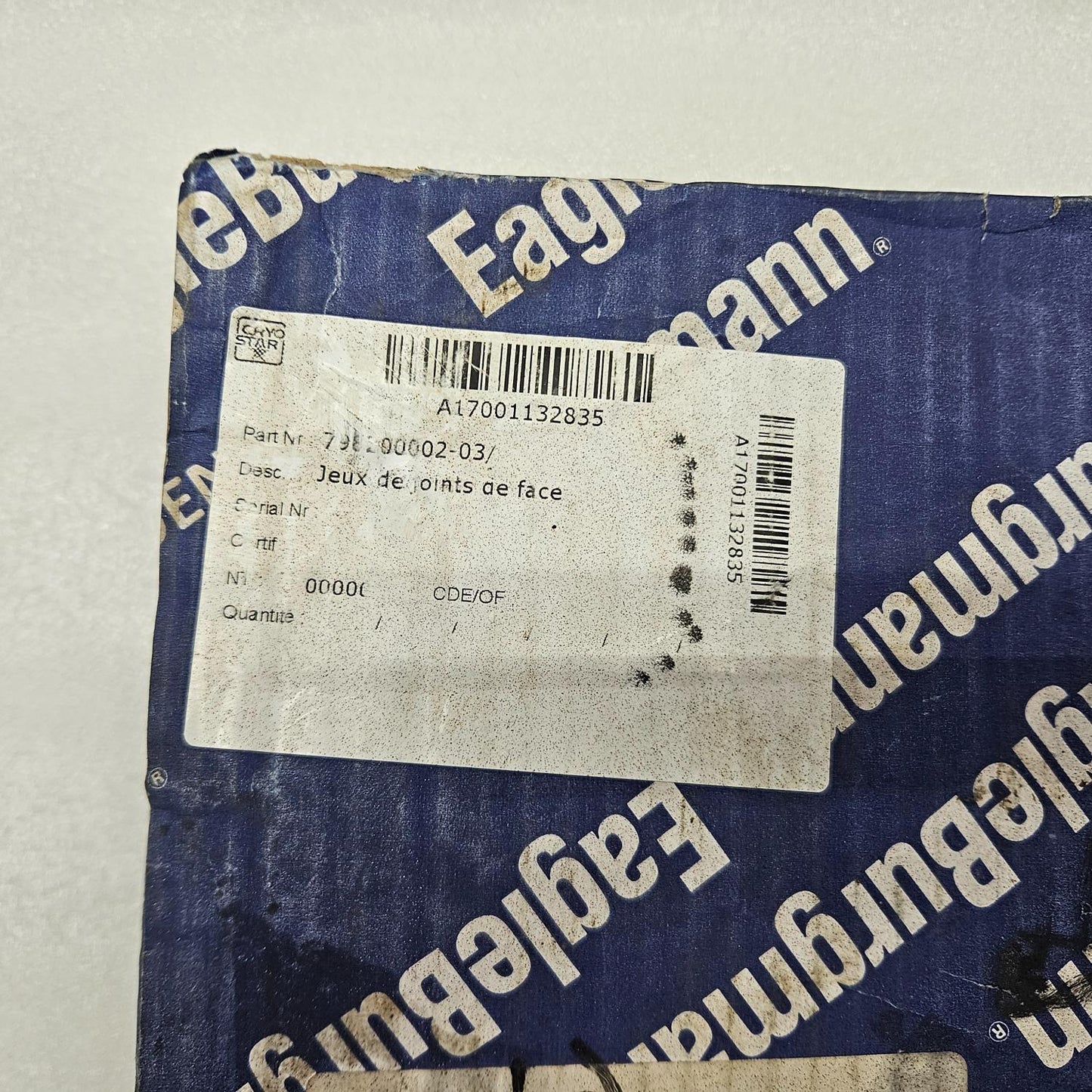 EagleBurgmann packaging with a label on a gray background