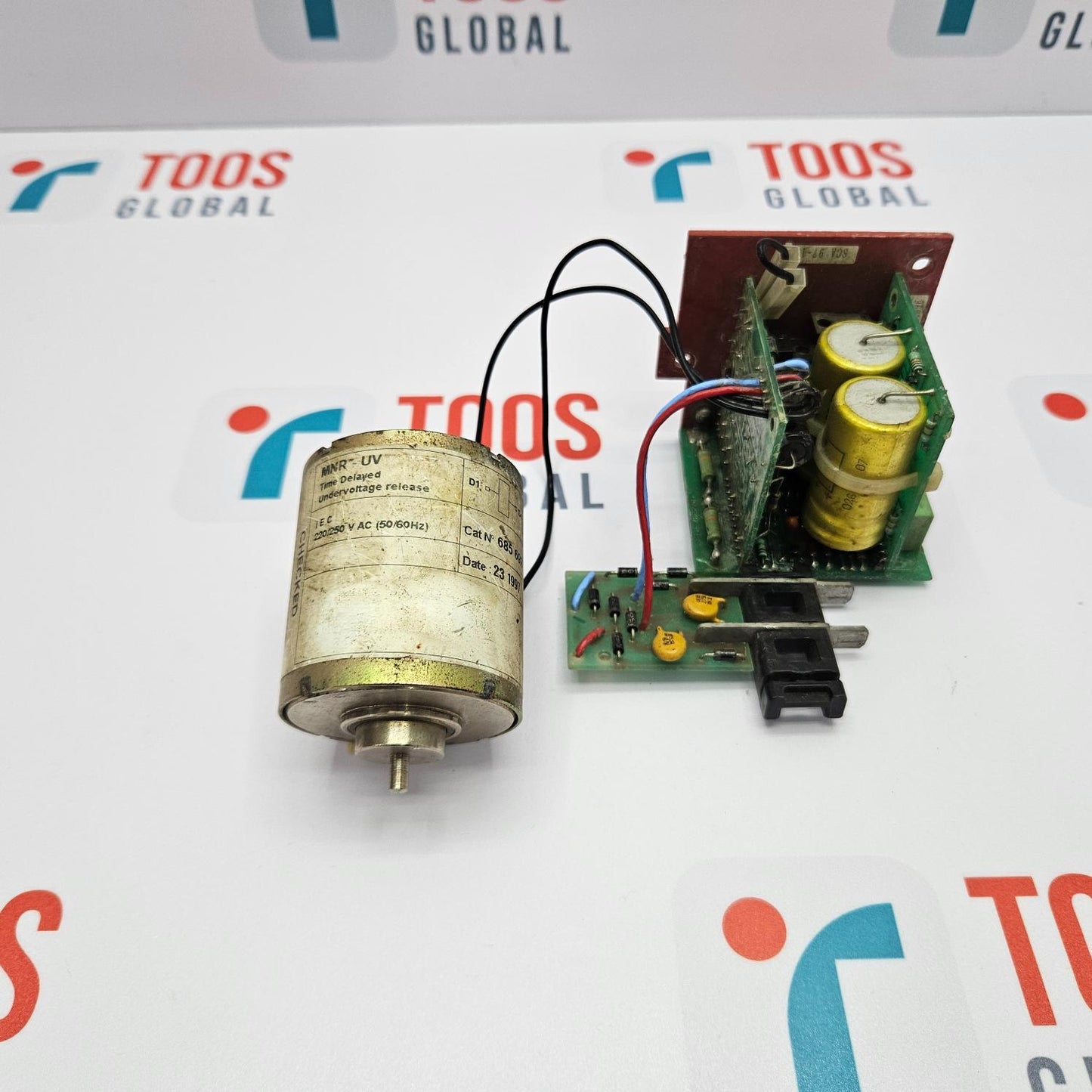 Mechanical component and electronic circuit board on a TOOS GLOBAL branded background