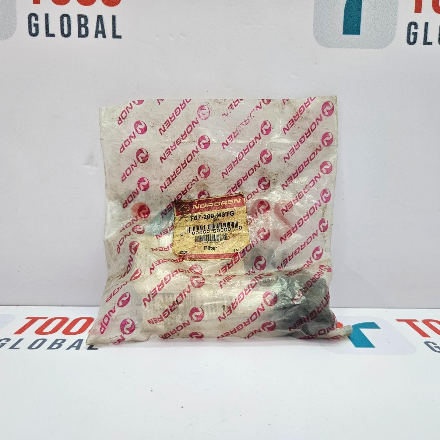 Packaged filter with Norgren branding on a white background
