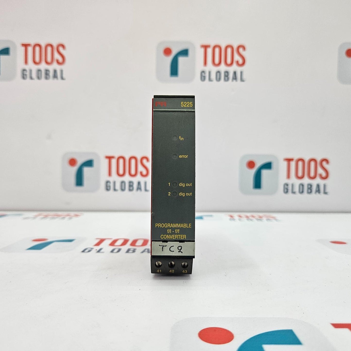 Black rectangular device with 'TOOS GLOBAL' branding on a white background
