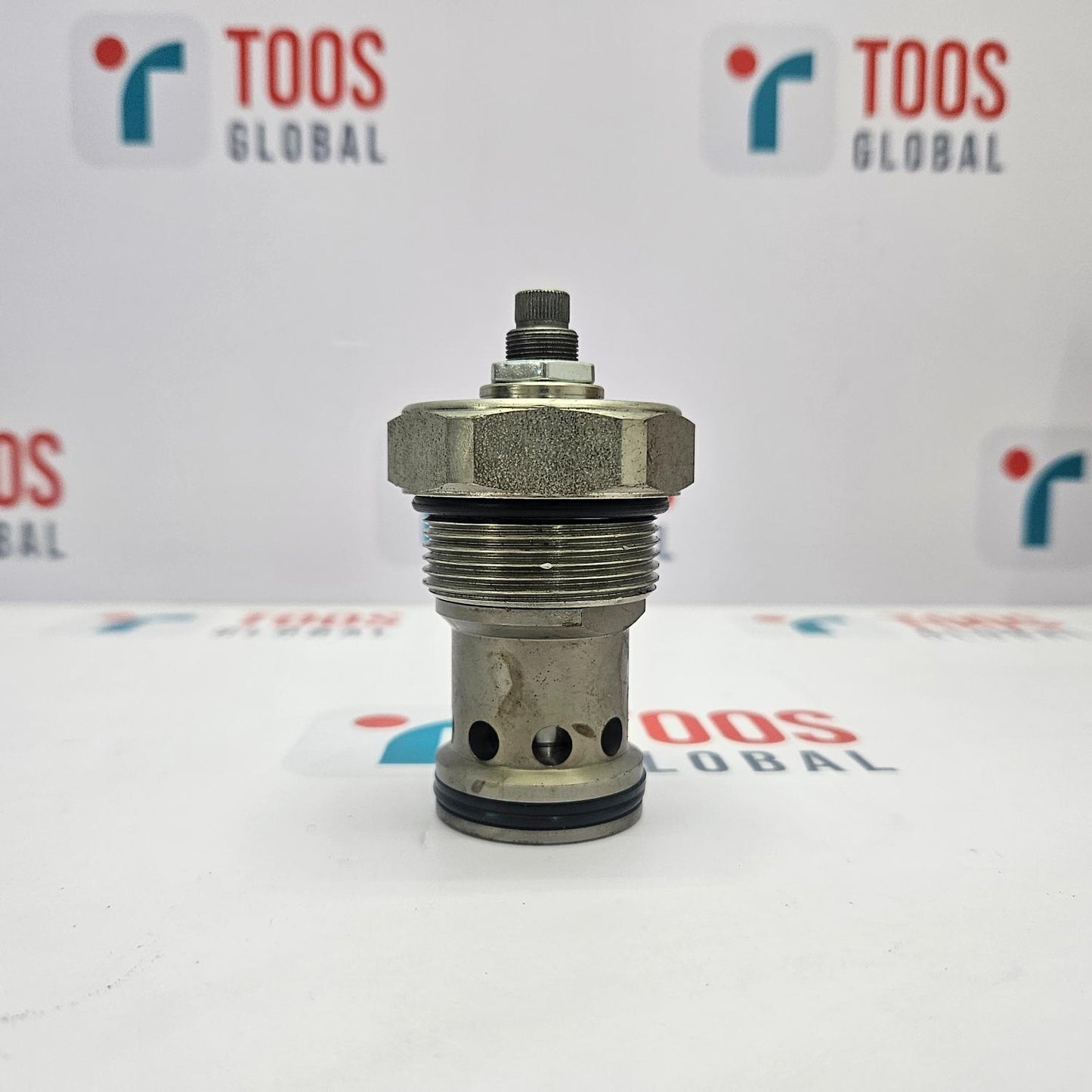Metal valve component on a white background with 'TOOS GLOBAL' branding.
