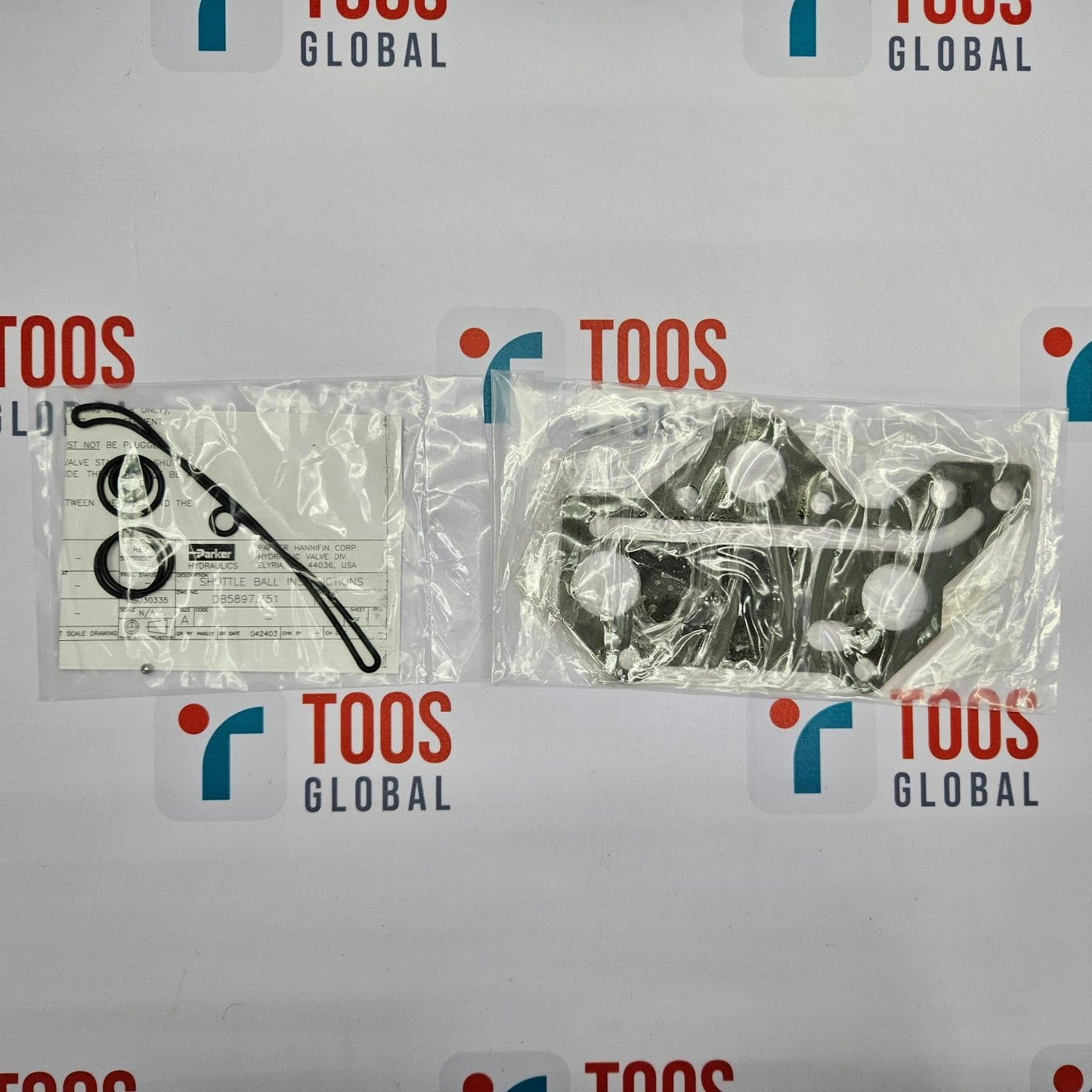 Two packages of medical supplies on a TOOS Global branded background