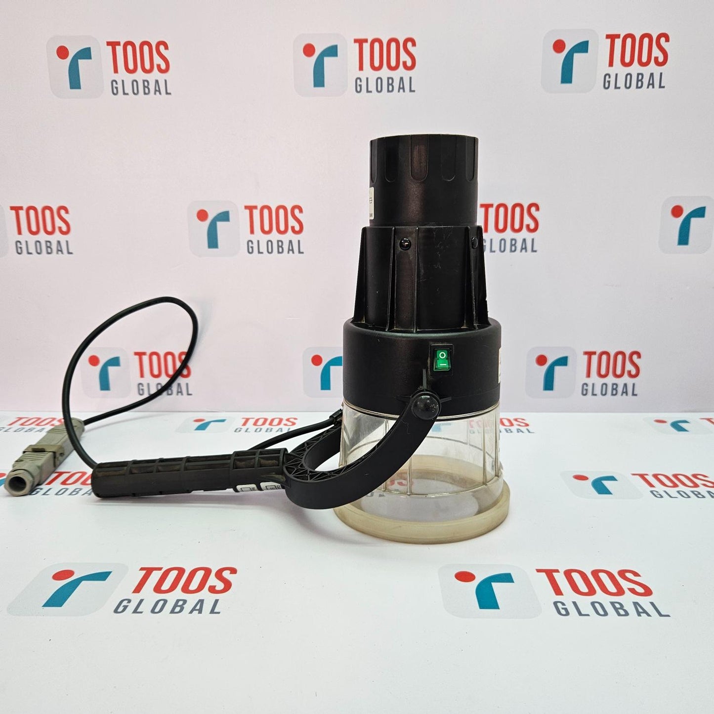 SOLO 424-001 HEAT DETECTOR TESTER 220-240V A SOLO heat detector tester, primarily black and clear in color, with a power cord and a cylindrical shape.
