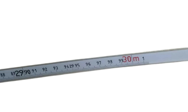 Metal ruler with measurement markings on a white background