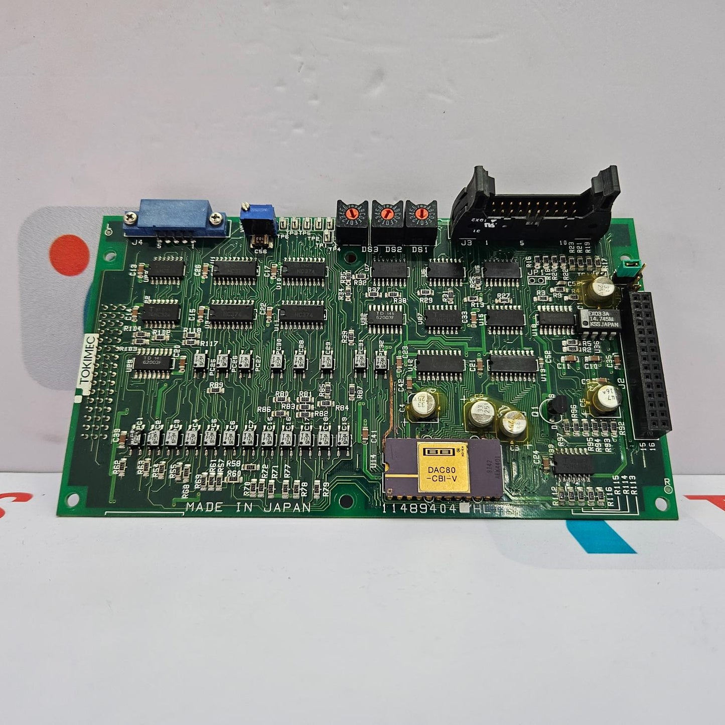 Electronic circuit board with various components on a white background
