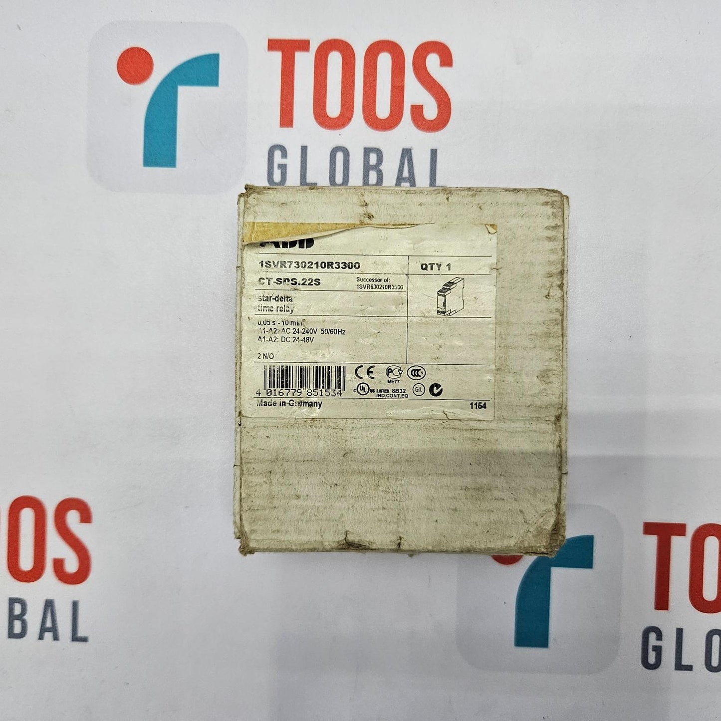 Cardboard box with a label on a white background featuring 'TOOS GLOBAL' branding.
