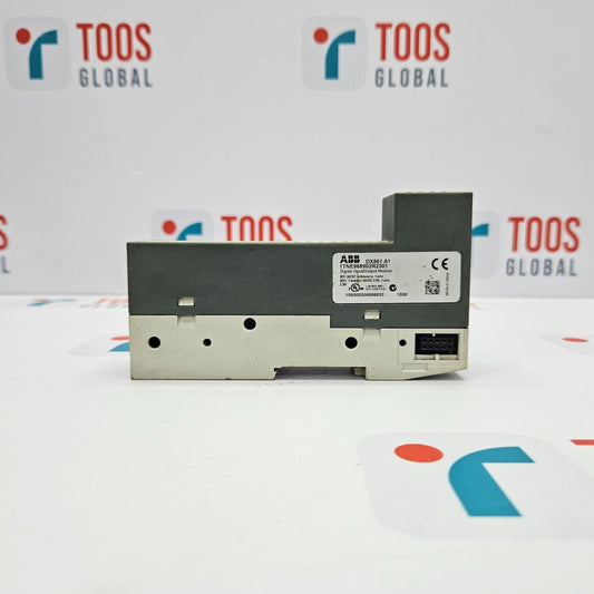 An ABB DX561 A1 Digital Input/Output Module, with a gray body and a black label on the front, placed on a white surface with the TOOS GLOBAL logo in the background.
