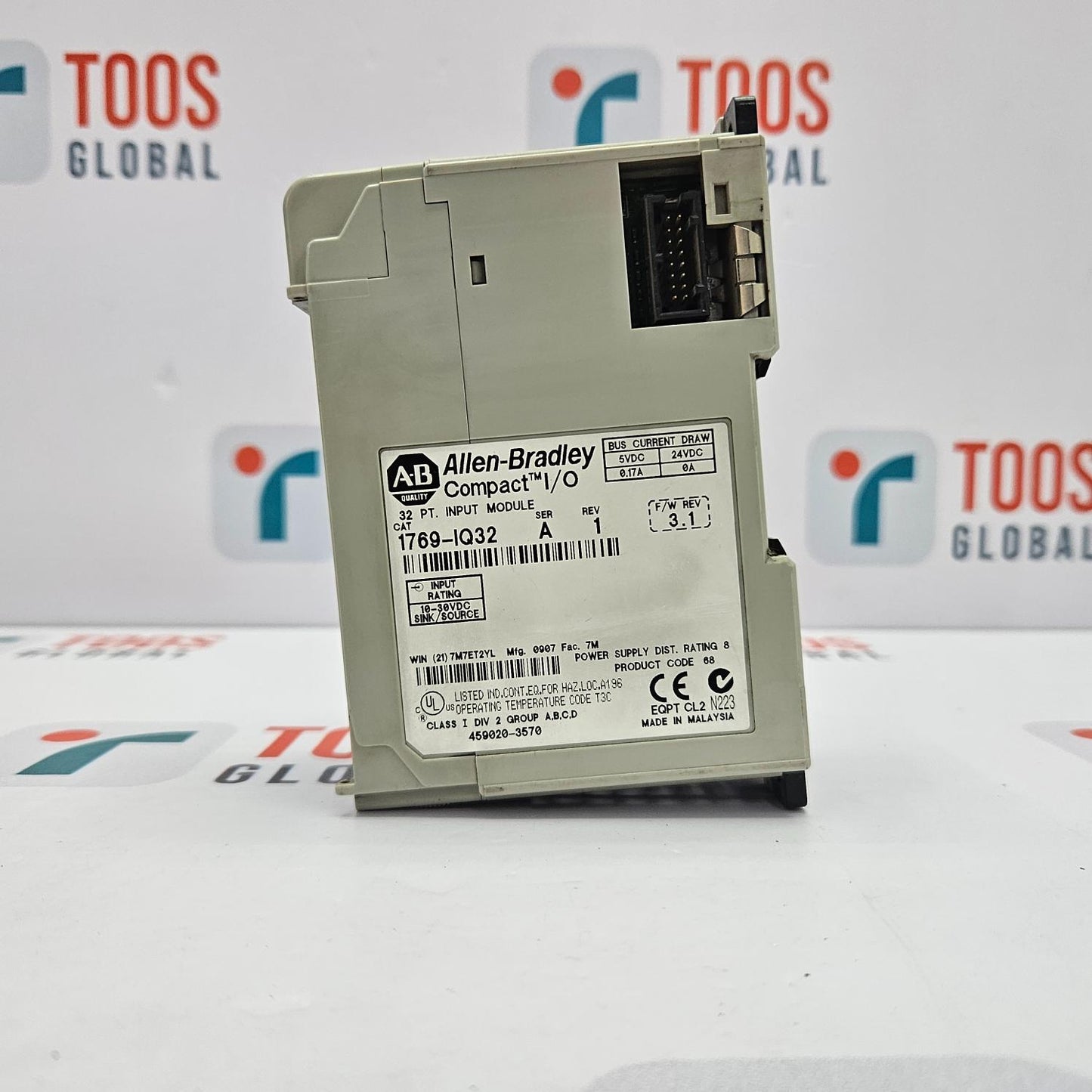 Allen-Bradley module on a white surface with blurred background