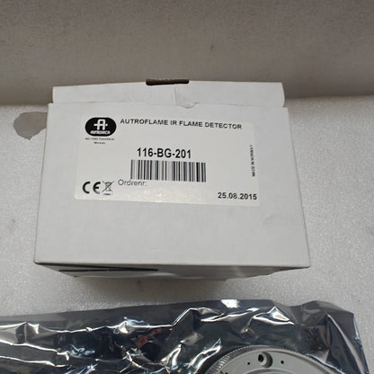 Autroflame IR flame detector packaging on a gray surface
