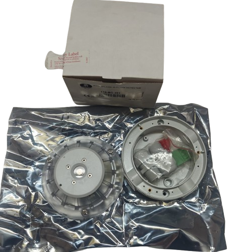 AUTRONICA 116-BG-201 AUTROFLAME IR FLAME DETECTOR on a reflective surface with a cardboard box in the background.