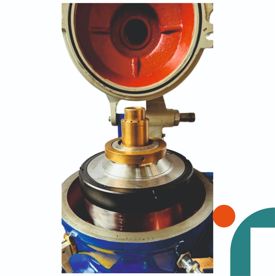 Close-up of a ALFA LAVAL MAB-103B with red, gold, and blue colors on a white background.