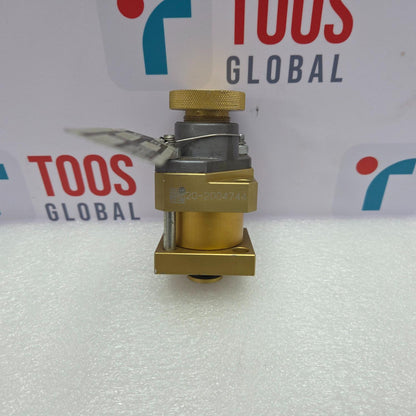 Gold valve on a white surface with 'TOOS GLOBAL' branding in the background.