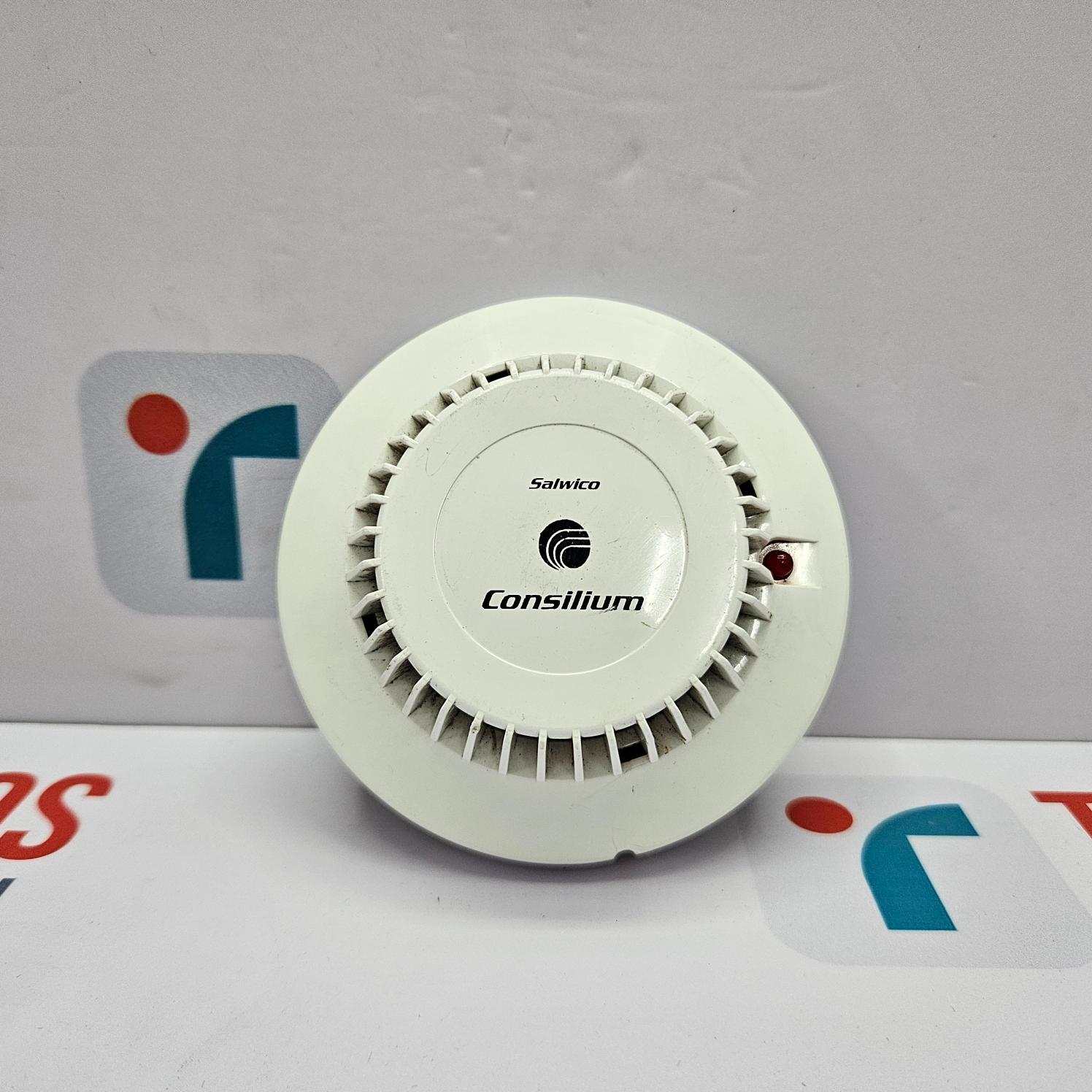 White fire alarm device with Consilium branding on a gray background