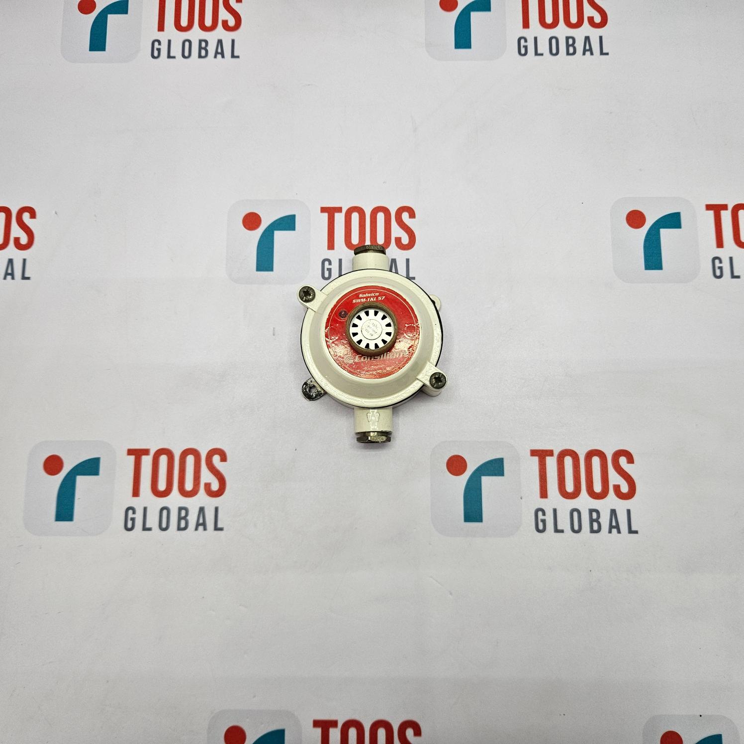 A CONSILIUM SALWICO SWM-1KL 57 heat detector, with a predominantly white body and red detailing, centered on a surface with the brand name 'TOOS GLOBAL' displayed.