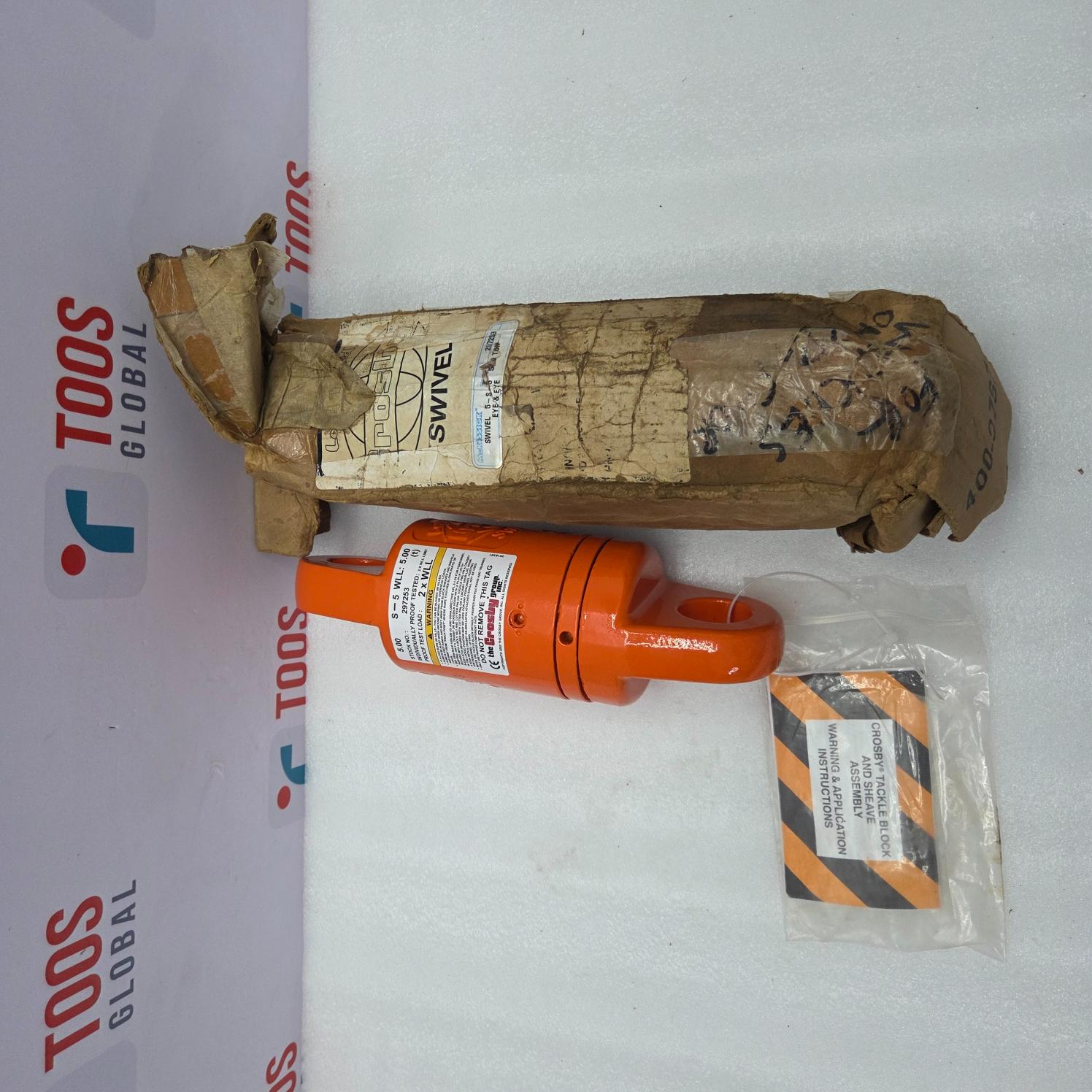 Orange CROSBY S5 with a label on a white surface with 'TOOS GLOBAL' branding.