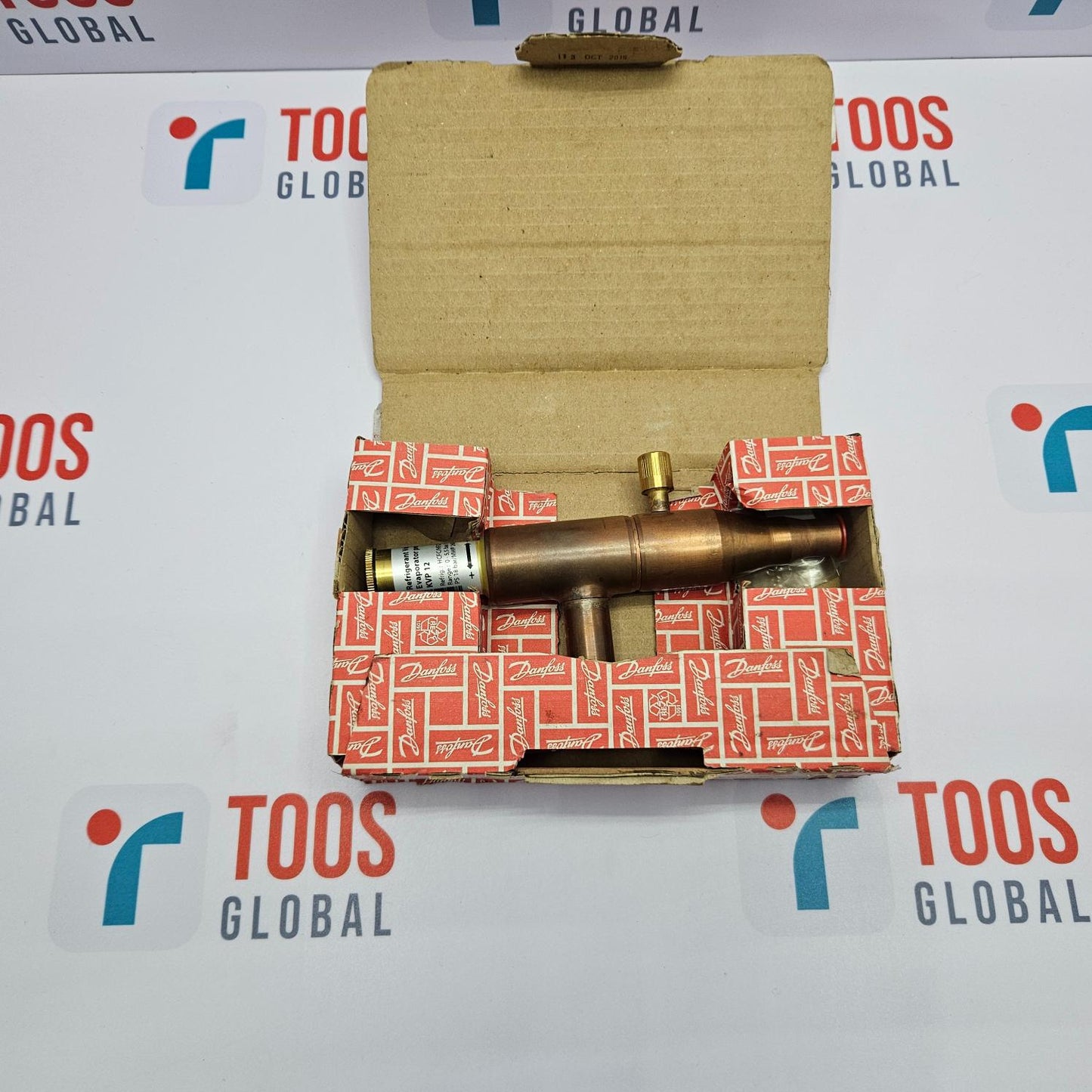 Brass valve in a red and white box on a TOOS GLOBAL branded background