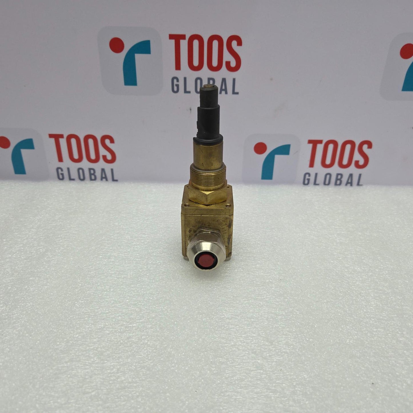 Brass valve with red indicator on a white background with 'TOOS GLOBAL' branding.