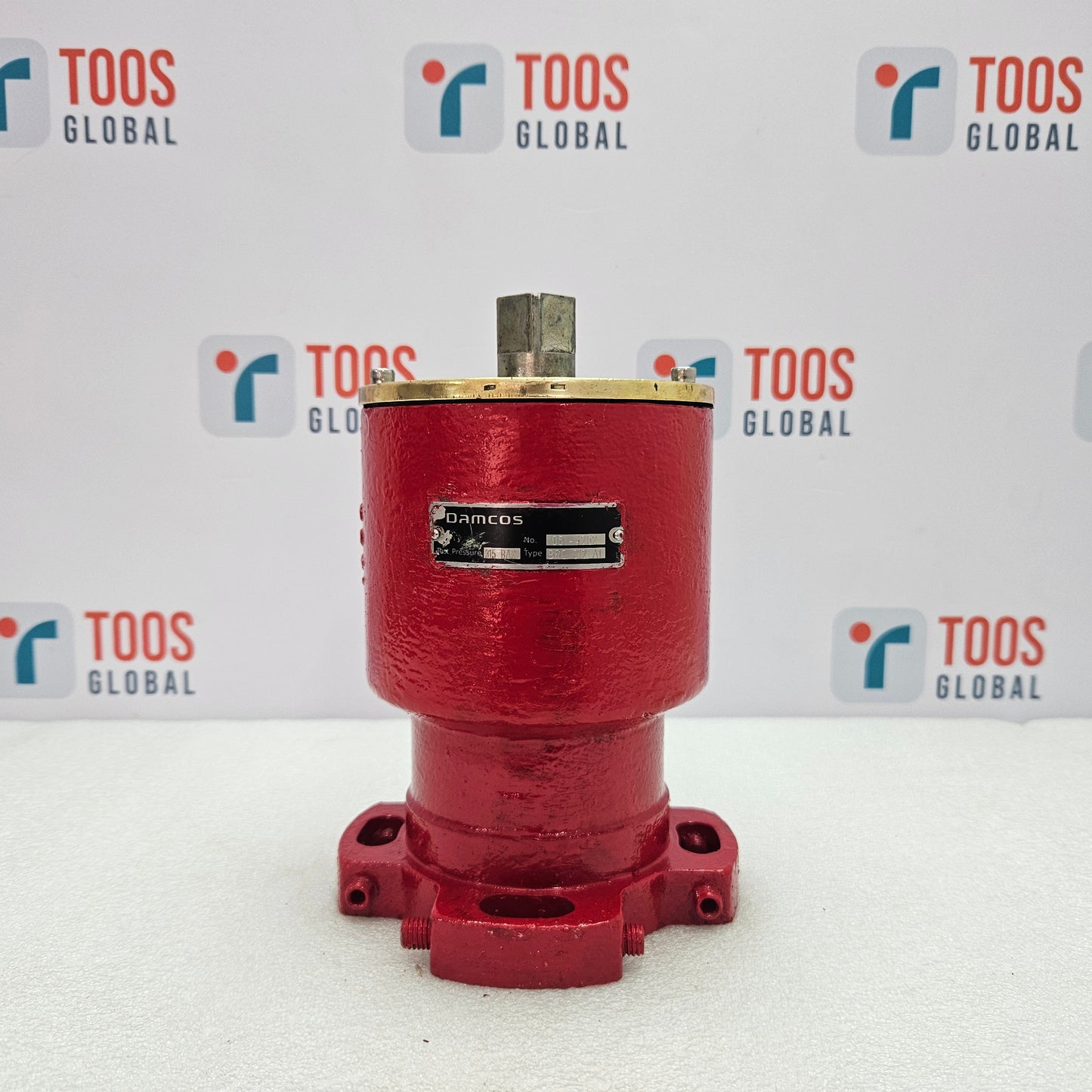 Red mechanical component with a brand label on a white background featuring the 'TOOS GLOBAL' logo.