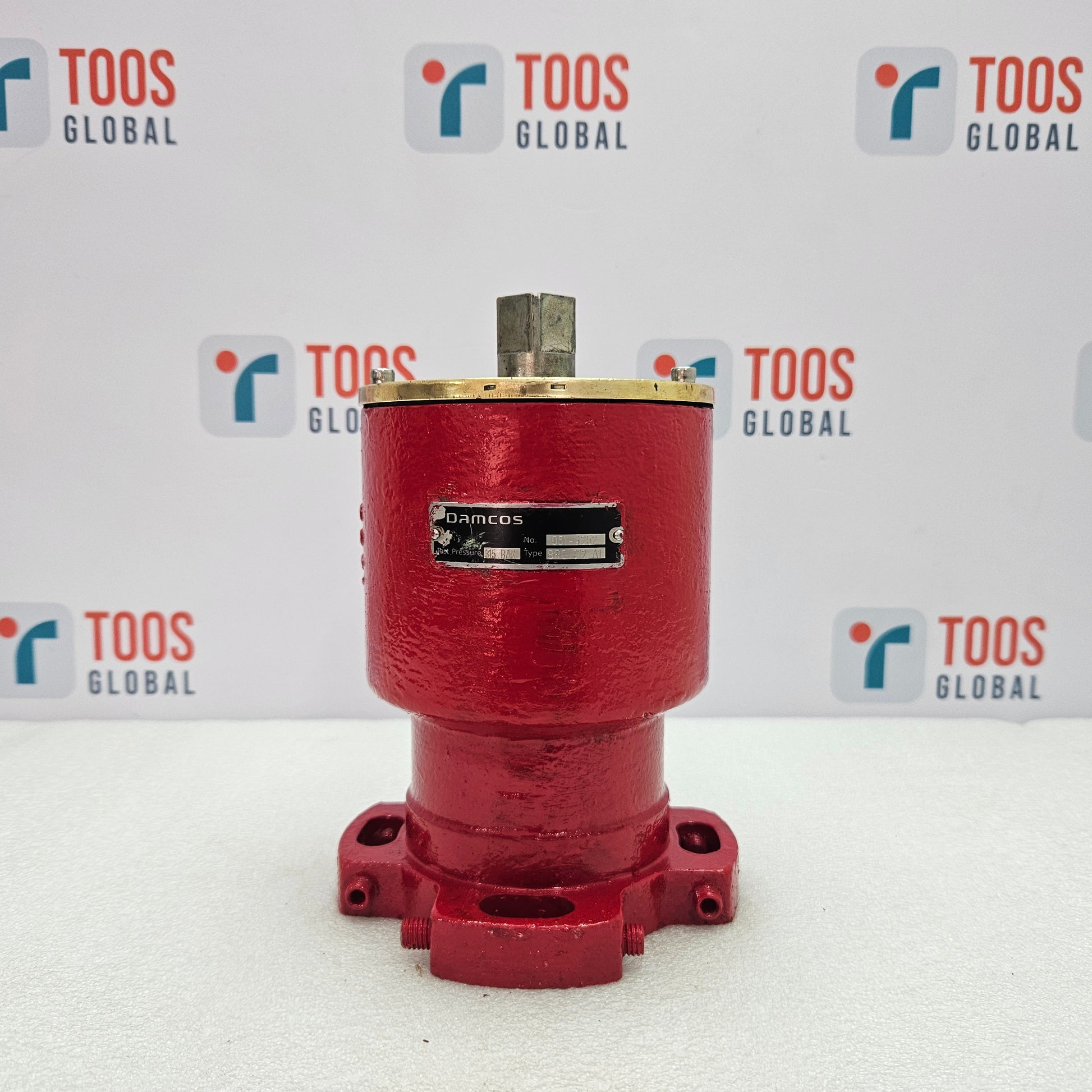 Red mechanical component with a brand label on a white background featuring the 'TOOS GLOBAL' logo.