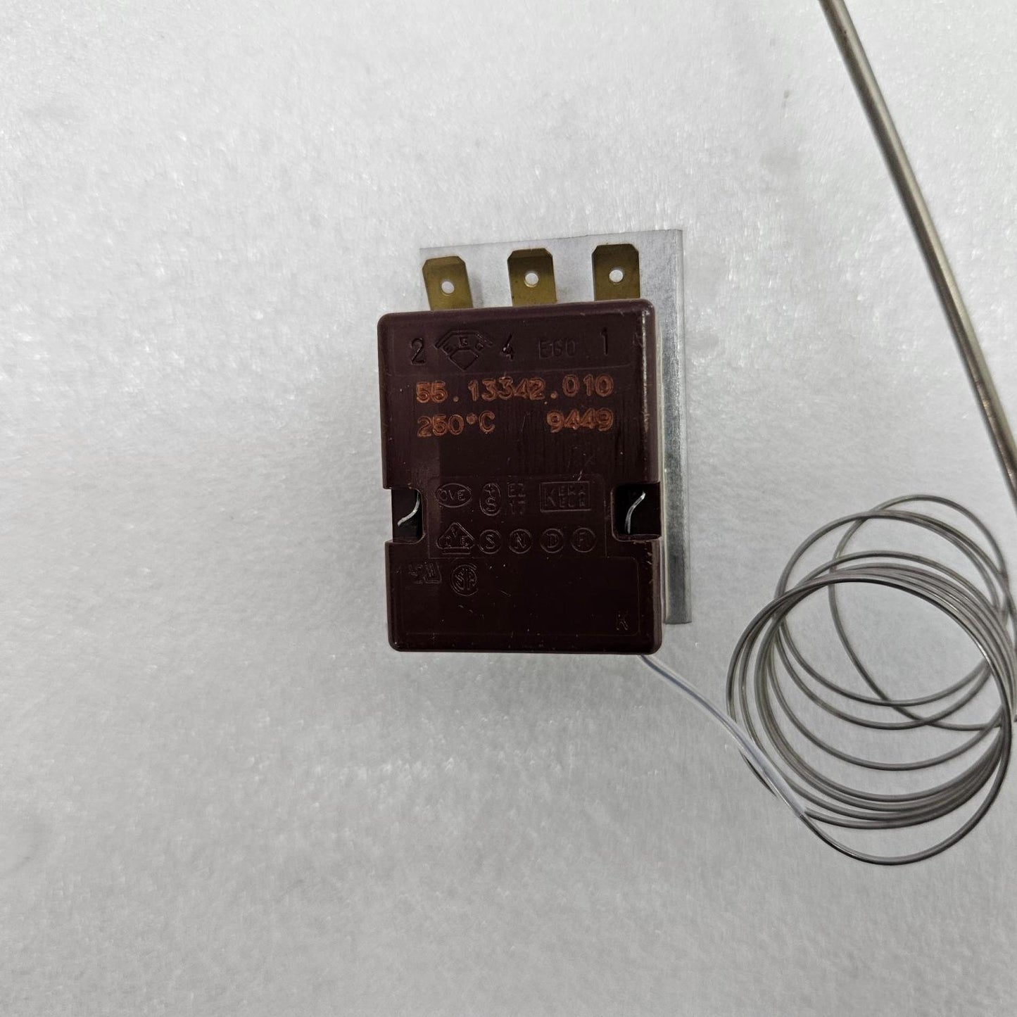 EGO 55.13342.010 THERMOSTAT 250°C NEW Temperature sensor with a coiled wire on a white background
