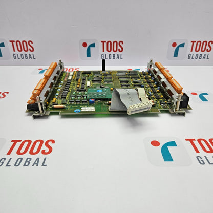 A printed circuit board (PCB) with various electronic components and connectors, laid out on a surface with the brand name 'ESAB' visible.