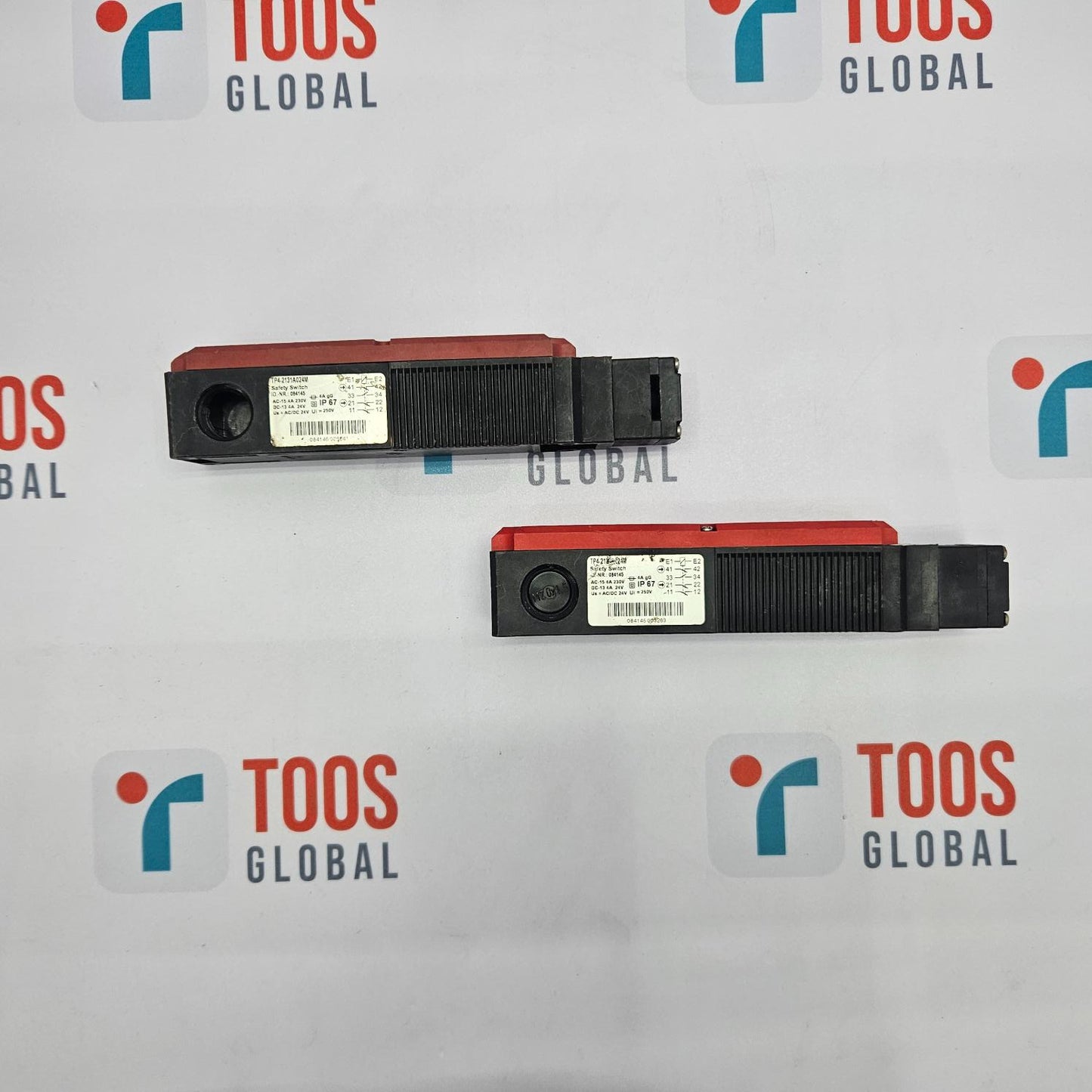 Two EUCHNER safety switches with model number TP4-2131A024M, predominantly black in color with red accents, displayed against a white background with the TOOS GLOBAL logo.
