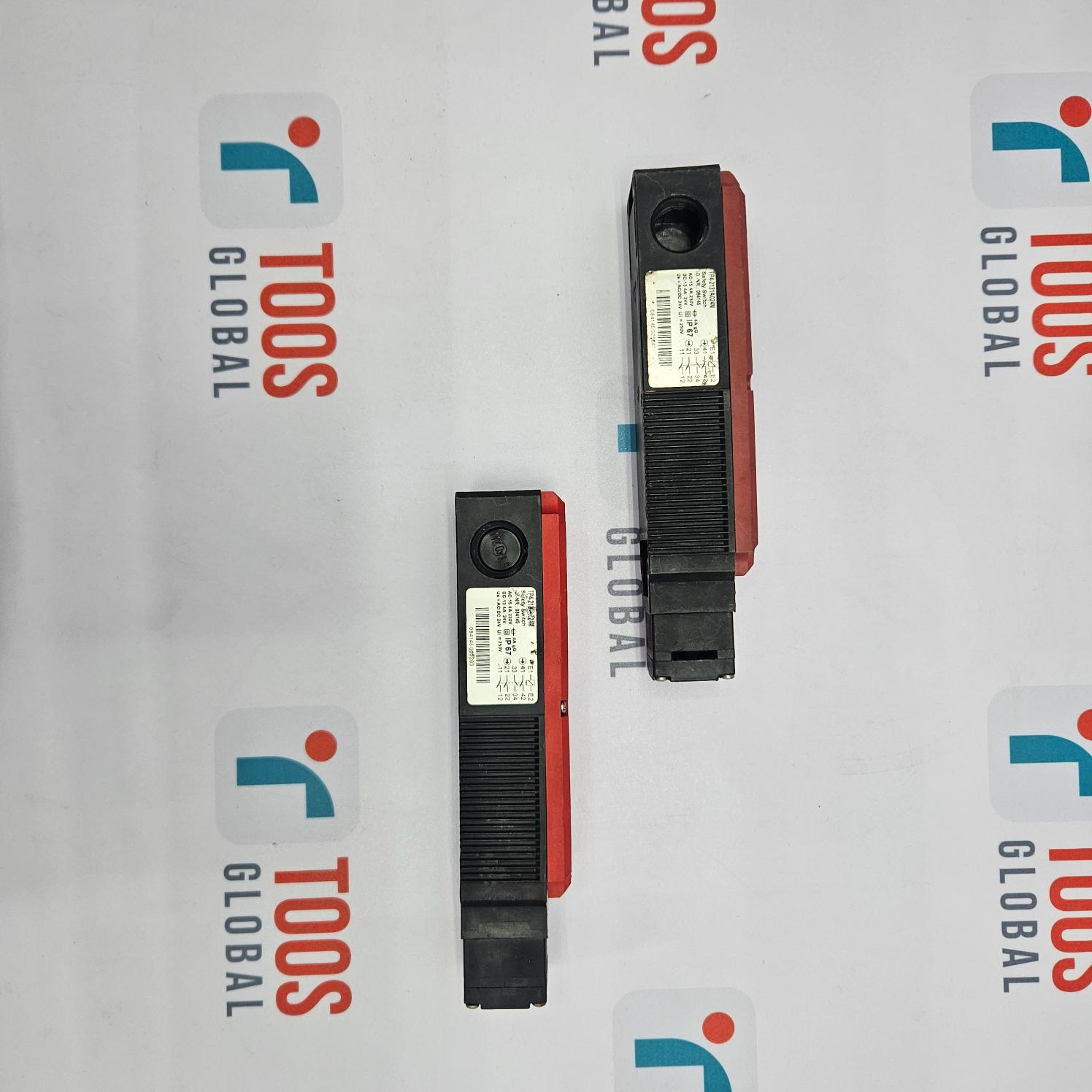 Two EUCHNER safety switches with model number TP4-2131A024M, predominantly black in color with red accents, displayed against a white background with the TOOS GLOBAL logo.