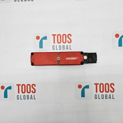 EUCHNER TP4-4141A024M SAFETY SWITCH EUCHNER safety switch, with a red actuation lever, mounted on a white surface with multiple TOOS GLOBAL logos.