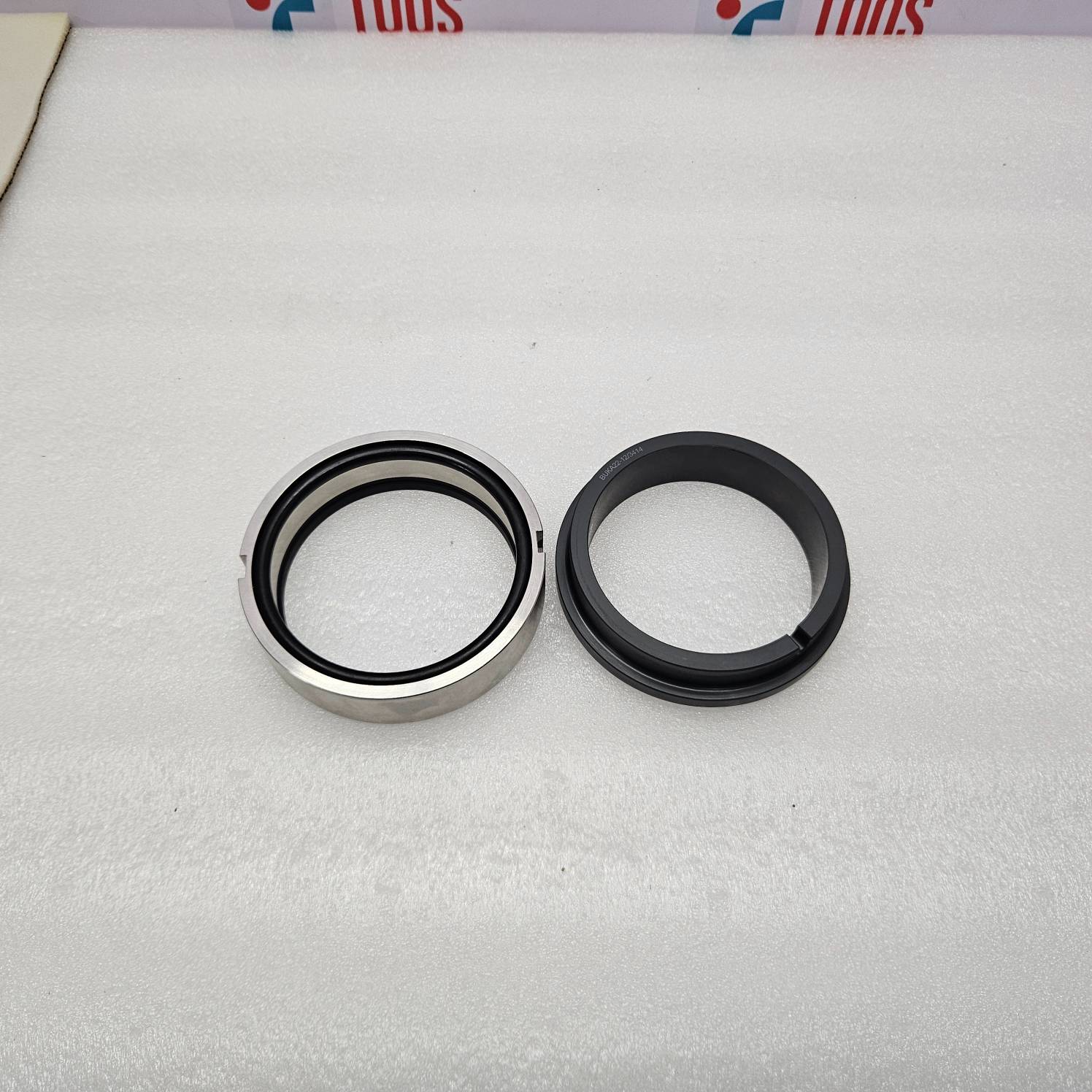 Two mechanical seals on a white background with visible brand logos.