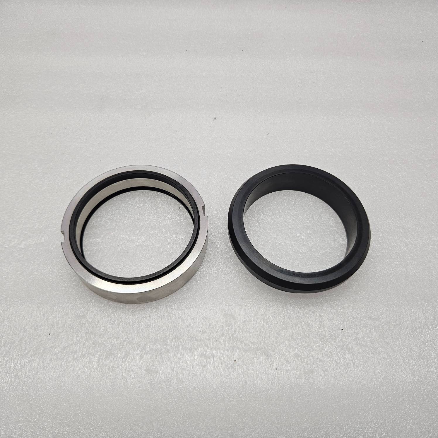 Two metal seals on a gray background