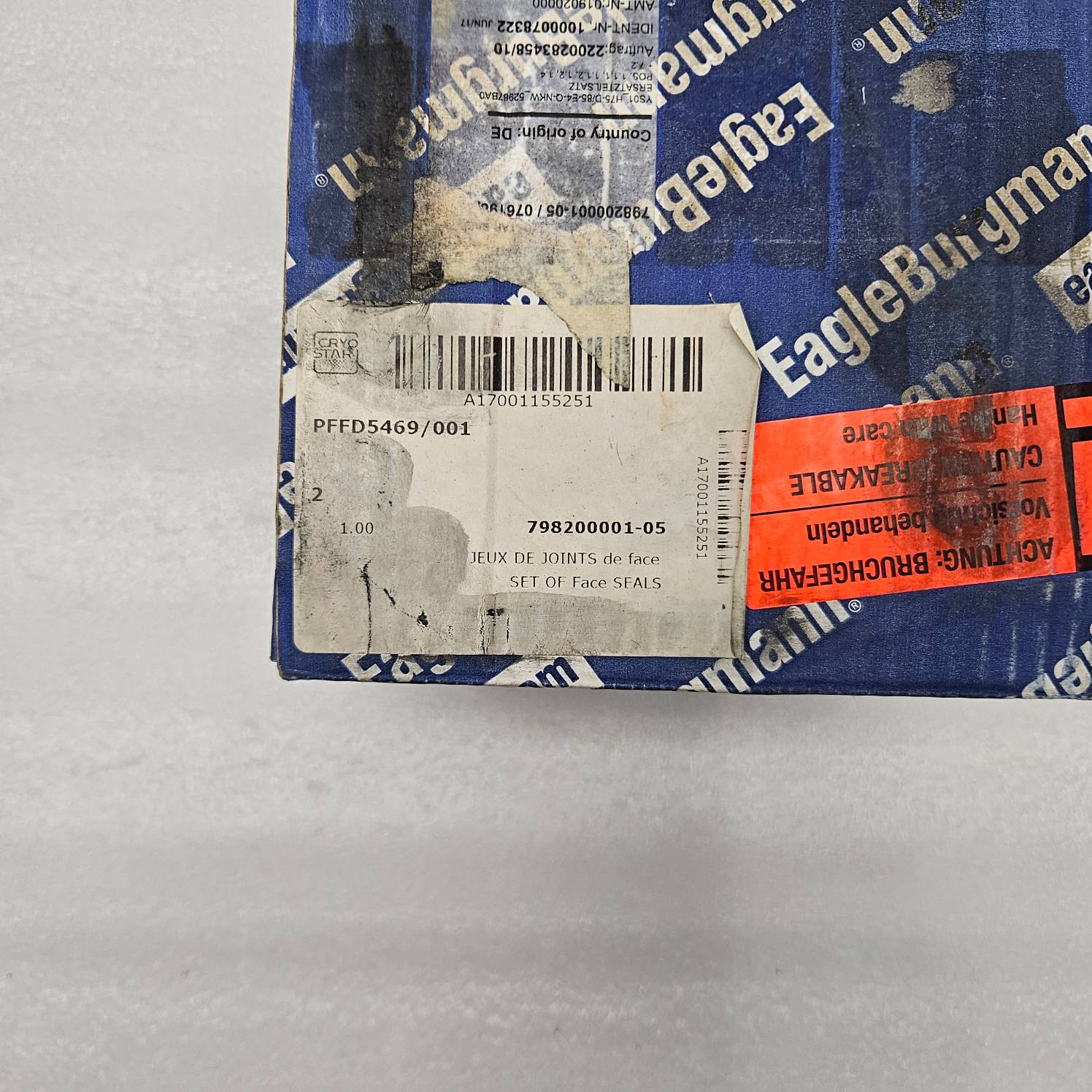Eagle Burgmann branded packaging with labels on a gray background