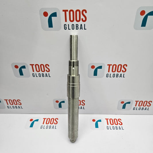 Metal cylindrical object with 'TOOS GLOBAL' branding in the background