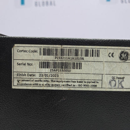 Label with Cortec code, serial number, finish date, and GE logo on a black surface.