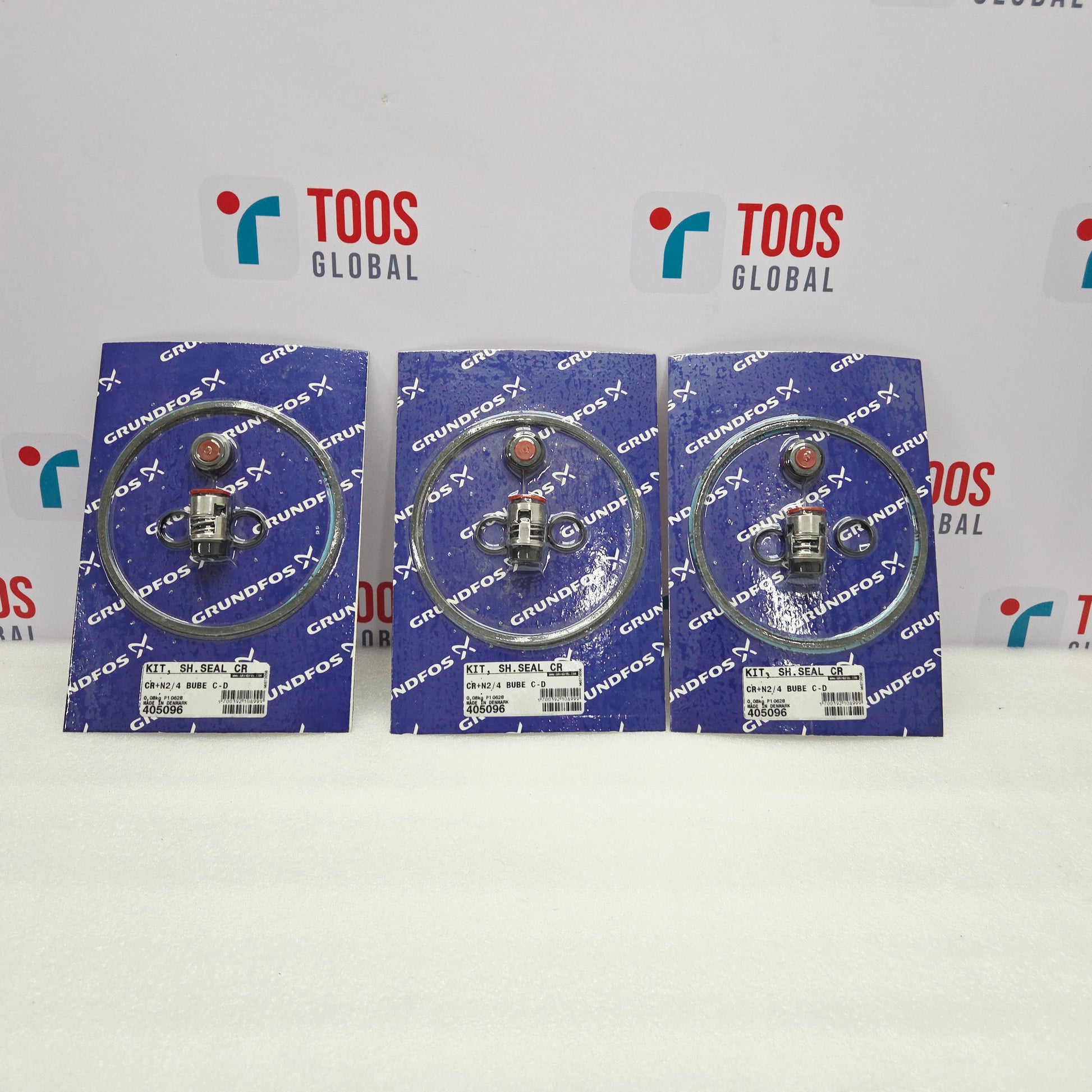 Three packages of Grundfos parts on a white background with TOOS Global branding.