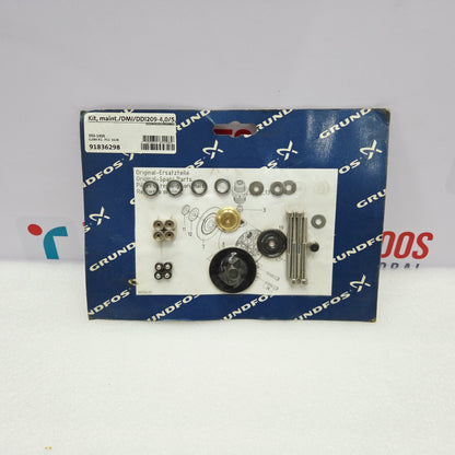 Set of mechanical parts on a Grundfos branded box with a white background