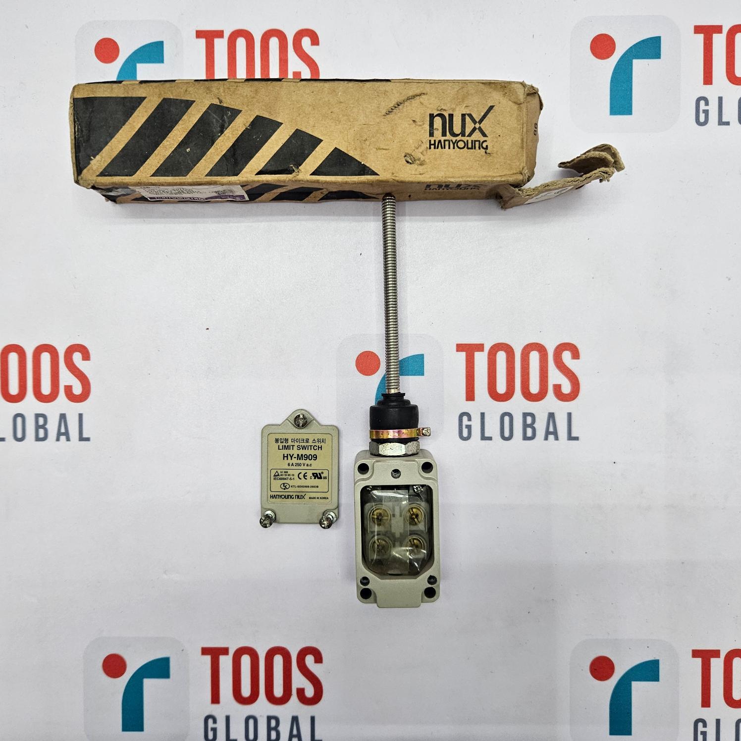 Mechanical valve component with cardboard box labeled 'Nux' on a TOOS Global branded background