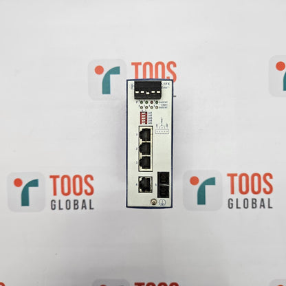 HIRSCHMANN RS2-4TX/1FX EEC RAIL SWITCH A HIRSCHMANN rail switch with four Ethernet ports, model RS2-4TX/1FX EEC, against a white background with the TOOS Global logo.
