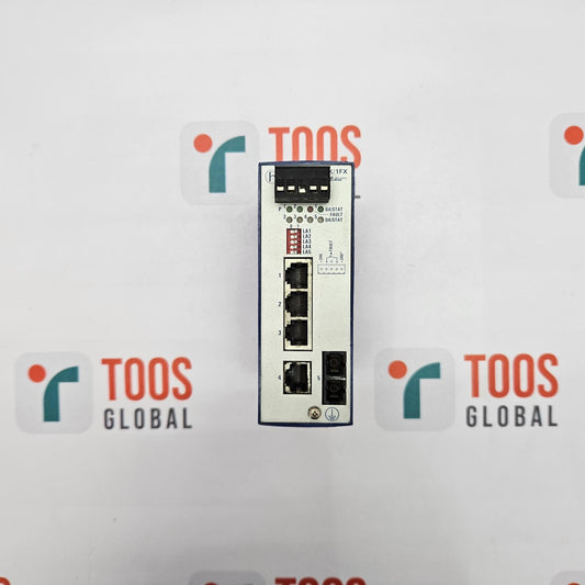 HIRSCHMANN RS2-4TX/1FX EEC RAIL SWITCH A HIRSCHMANN rail switch with four Ethernet ports, model RS2-4TX/1FX EEC, against a white background with the TOOS Global logo.