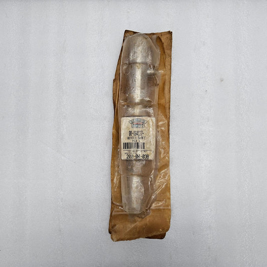 Metallic object in a brown paper package on a gray background