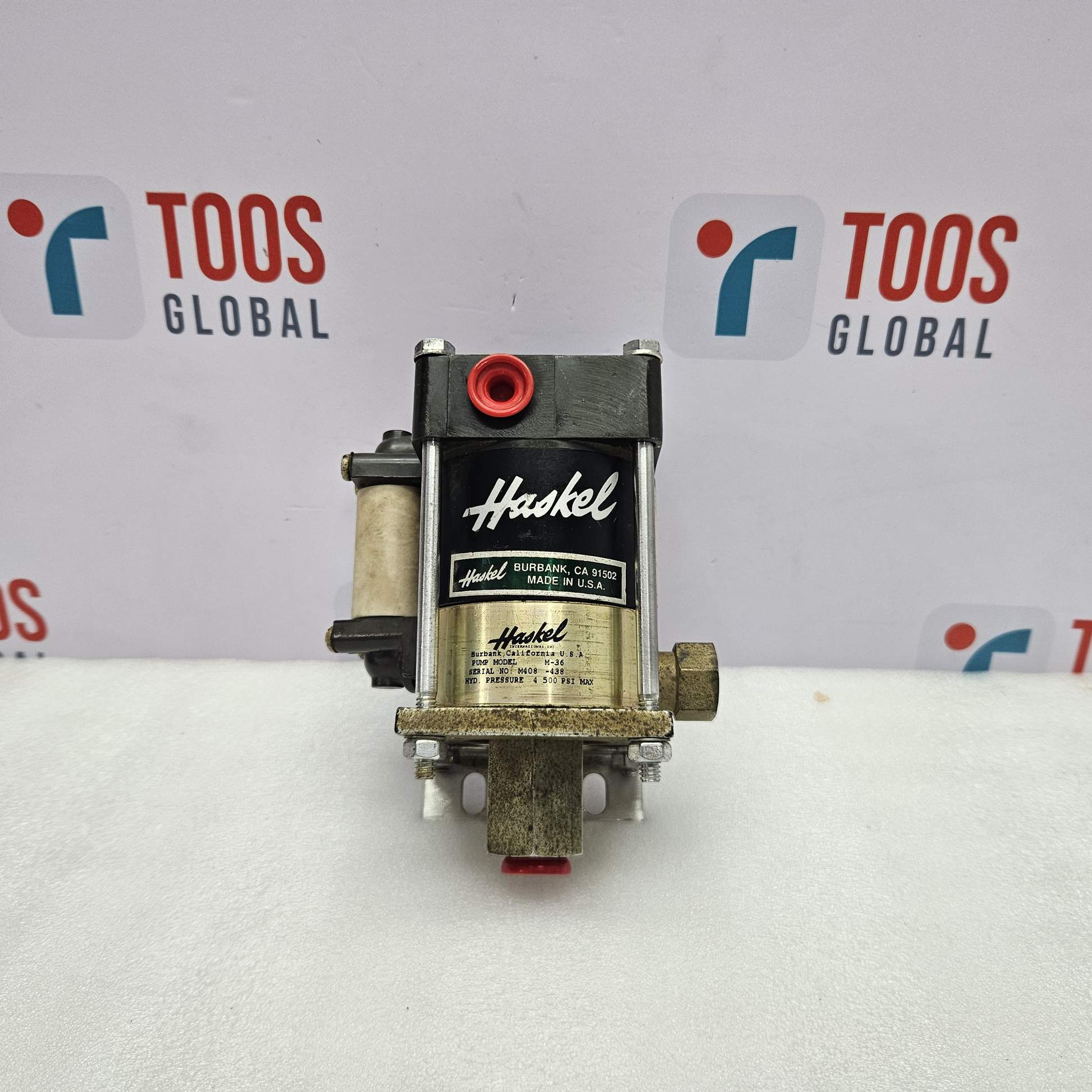 Haskel M-36 Pneumatic Driven Liquid Pump 4500 PSI with toos global logo in background