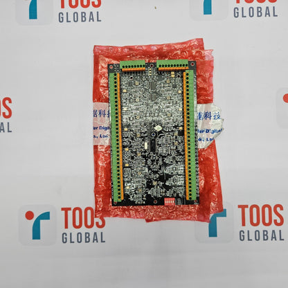 Electronic circuit board in a red plastic bag with 'TOOS GLOBAL' branding in the background.