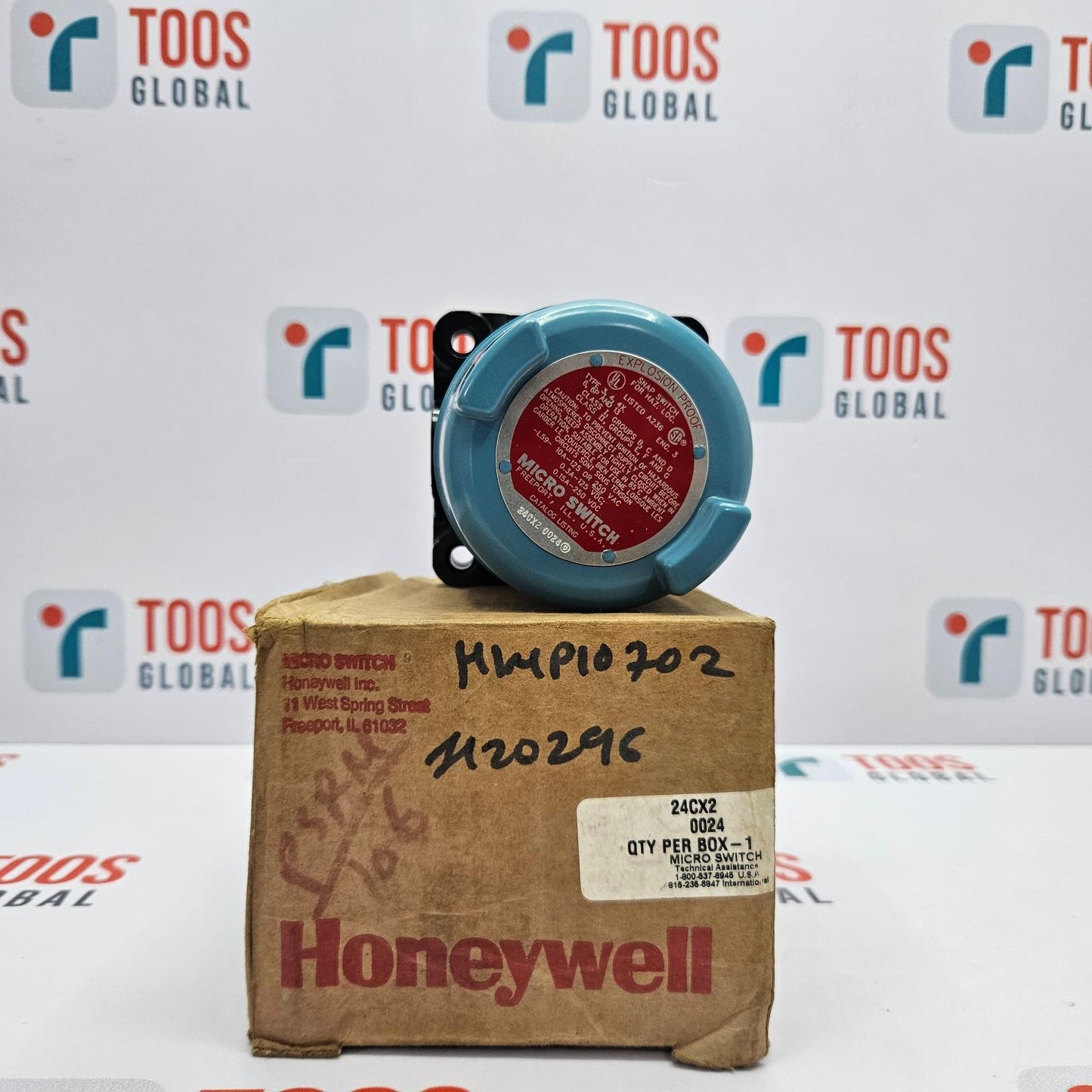 Honeywell 24cx2 Explosion Proof Microswitch Honeywell micro switch on a cardboard box with TOOS Global branding in the background.