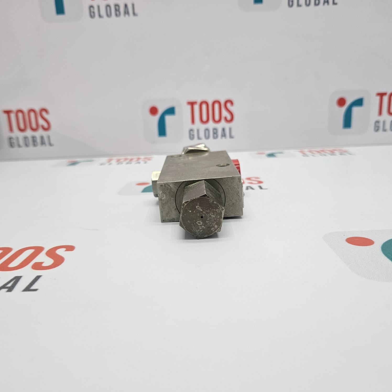 Metal component on a TOOS Global branded background