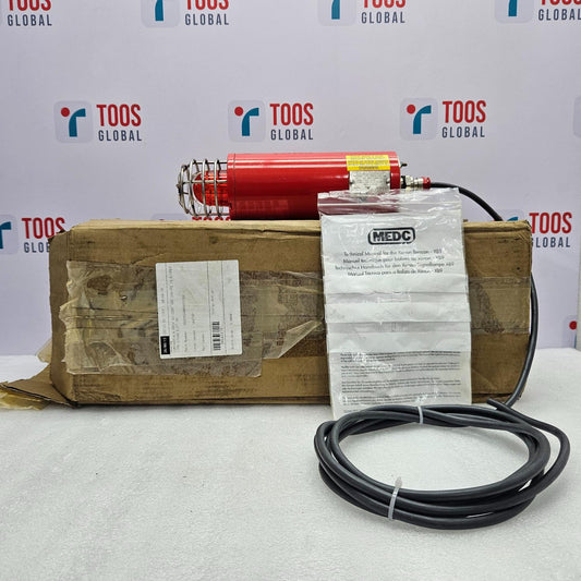 Red cylindrical light with a cable on a wooden box against a TOOS Global branded background