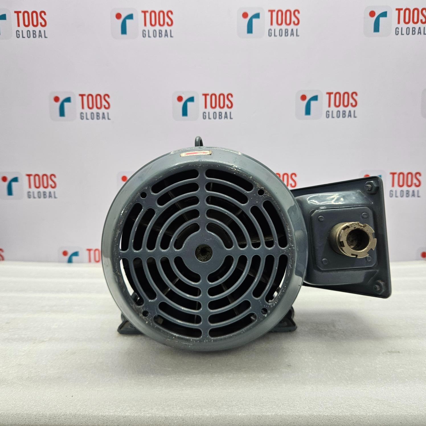 Motor on a white surface with 'TOOS GLOBAL' branding in the background