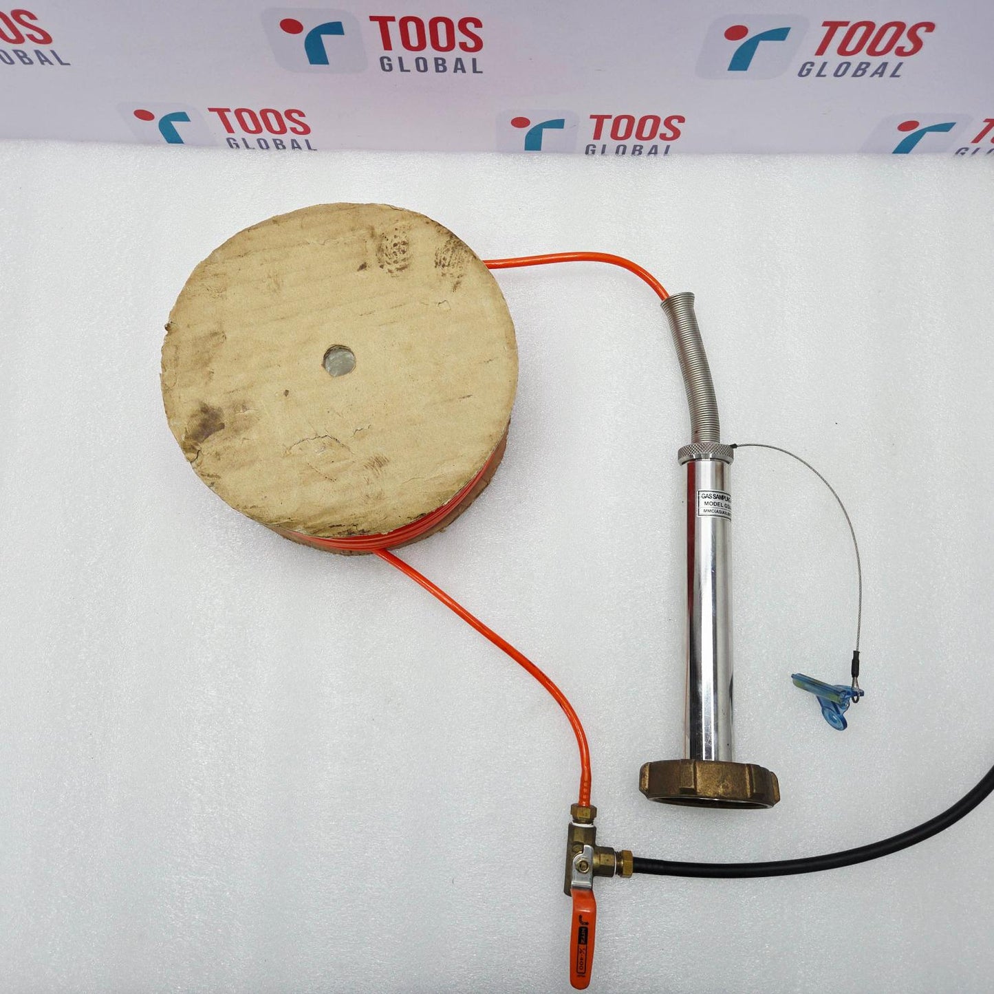 MMC GSA - F GAS SAMPLER with a spool, pump, and hoses on a TOOS Global branded background