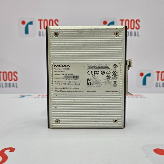 The image shows a MOXA EDS-405A Ethernet switch with 5 ports. The device is silver, with a metal casing and branding information visible on the front.